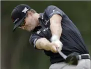  ?? TONY DEJAK — ASSOCIATED PRESS ?? Zach Johnson tees off on the third hole during the third round of the Bridgeston­e Invitation­al at Firestone Country Club.