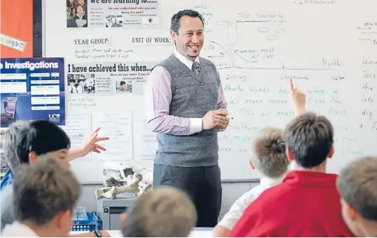  ?? Photo: KIRK HARGREAVES/FAIRFAX NZ ?? Apple of their eye: Medbury Preparator­y School teacher Micah Hocquard has been named the country’s most inspiring, after being nominated by pupilSamHo­ward.