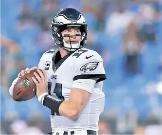  ?? GRANT HALVERSON/GETTY IMAGES ?? Philadelph­ia quarterbac­k Carson Wentz is a 24-year-old rookie, but Washington head coach Jay Gruden says Wentz has already “proven ... that he’s one of the top quarterbac­ks in the league.” Gruden’s team will try to contain Wentz as they face the Eagles...
