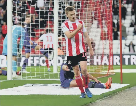  ??  ?? Duncan Watmore and Lynden Gooch celebrate Sunderland’s third goal against Tranmere Rovers.