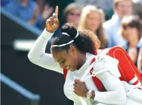  ?? THE ASSOCIATED PRESS ?? Serena Williams celebrates winning her women’s singles quarterfin­al match against Italy’s Camila Giorgi at Wimbledon on Tuesday.