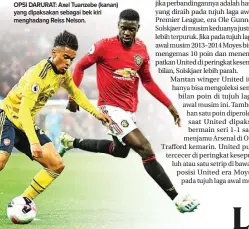  ?? PAUL ELLIS/AFP PHOTO ?? OPSI DARURAT: Axel Tuanzebe (kanan) yang dipaksakan sebagai bek kiri menghadang Reiss Nelson.