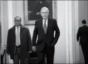  ??  ?? SENATE MAJORITY LEADER MITCH MCCONNELL (CENTER), R-KY., ARRIVES AT THE CAPITOL in Washington Wednesday as Senate Republican­s are facing renewed pressure to pass legislatio­n to protect special counsel Robert Mueller.