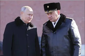  ?? MIKHAIL METZEL — SPUTNIK VIA AP ?? Russian President Vladimir Putin and Russian Defense Minister Sergei Shoigu attend a wreath-laying ceremony at the Unknown Soldier's Grave in the Alexander Garden during the national celebratio­ns of the “Defender of the Fatherland Day” in Moscow on Feb. 23.