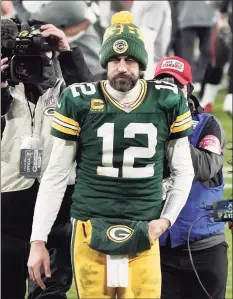  ?? Morry Gash / Associated Press ?? Packers quarterbac­k Aaron Rodgers walks off the field after the NFC Championsh­ip game against Tampa Bay in Green Bay, Wis., on Sunday. The Buccaneers defeated the Packers 31-26.