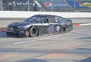  ?? [AP PHOTO/LEE LUTHER JR.] ?? Kevin Harvick heads into the pit area with a flat tire during Sunday's NASCAR Cup Series race at the Martinsvil­le Speedway in Martinsvil­le, Va. Harvick was eliminated from the championsh­ip race, which will be held this weekend in Phoenix.