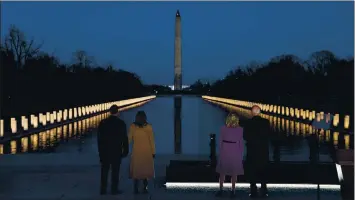  ?? EVAN VUCCI — THE ASSOCIATED PRESS ?? President-elect Joe Biden and his wife, Jill Biden, are joined by Vice President-elect Kamala Harris and her husband, Doug Emhoff, during a COVID-19 memorial event at the Lincoln Memorial Reflecting Pool in Washington on Tuesday.