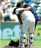  ??  ?? Kusal Perera receives treatment after being hit on day three of the second test against Australia.