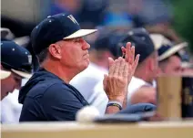  ?? WALT UNKS/THE WINSTON-SALEM JOURNAL VIA THE AP ?? Wake Forest head coach Tom Walter encourages his Deacons on May 19 in their 7-5 win over Virginia Tech at Couch Field in Winston-Salem, N.C. Baseball has often played a secondary role during his 27-year career even though he has won more than 800 games and taken three different schools to the national tournament.