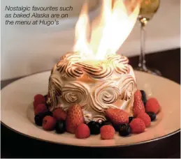  ??  ?? Nostalgic favourites such as baked Alaska are on the menu at Hugo’s