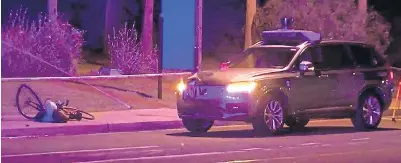  ?? Pictures: UNINAS ?? The driverless Uber car and Elaine Herzberg’s bicycle in the aftermath of the crash in Tempe, Arizona