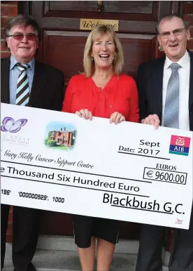  ??  ?? Michael Kane and Gerry Flanagan of Blackbush Golf Club presenting a cheque to Anne Tracey of the Gary Kelly Cancer Support Centre.