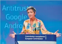  ?? JOHN THYS/AFP/GETTY IMAGES ?? The EU’s Margrethe Vestagersa­ys restrictin­g competitio­n “wasn’t just a remote possibilit­y from theory books.”