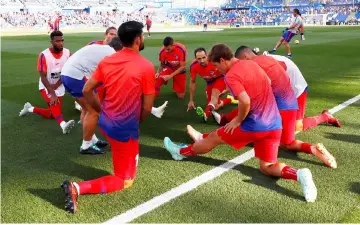  ??  ?? Atletico Madrid players warms up before the match at the Coliseum Alfonso Perez in Getafe, Spain in this Sept 22 file photo. — Reuters photo