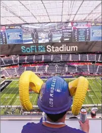  ?? Allen J. Schaben Los Angeles Times ?? A FAN views the field before the start of Super Bowl LVI between the Rams and Cincinnati last year at SoFi Stadium.