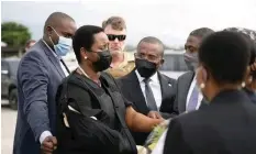  ?? | Reuters ?? WIDOW of assassinat­ed Haitian President Jovenel Moise, Martine, is greeted by government officials after arriving from the US in Port-au-Prince at the weekend.