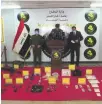  ??  ?? Iraqi officials display drugs and weapons seized