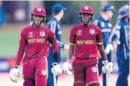  ?? COURTESY OF ICC MEDIA ?? Jewel Andrew (left) and Nathan Edward smile after steering West Indies to victory over Scotland during an ICC Under-19 World Cup game at Senwes Park in Potchefstr­oom, South Africa, yesterday.