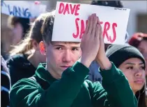  ?? Austin Dave/The Signal (See additional photos at signalscv.com) ?? A student connects his hands in prayer during a moment of silence at a demonstrat­ion at Golden Valley High on Wednesday.