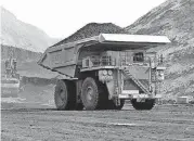  ?? [AP FILE PHOTO] ?? A dump truck hauls coal at Cloud Peak Energy’s Spring Creek strip mine near Decker, Mont., in this 2013 photo. The Trump administra­tion is considerin­g using West Coast military bases or other federal properties as transit points for shipments of U.S. coal and natural gas to Asia.