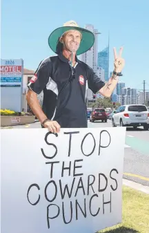  ?? Picture: GLENN HAMPSON ?? Craig Dight from Surfers Paradise protesting on the side of the road at Broadbeach.