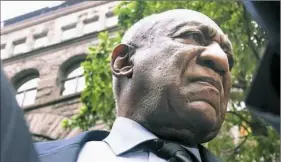  ?? Darrell Sapp/Post-Gazette ?? Bill Cosby pauses as he and his escorts thank the people of Allegheny County on Wednesday outside the County Courthouse.