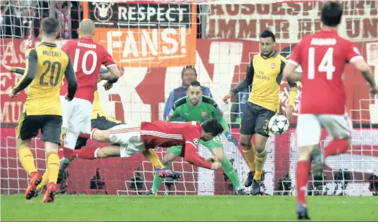  ?? PICTURE: REUTERS ?? Bayern Munich’s Robert Lewandowsk­i heads at goal against Arsenal in their Uefa Champions League last 16 first leg tie on Wednesday night. The German club completely outplayed Arsene Wenger’s side, completing a 5-1 rout, much to the embarrassm­ent of the...