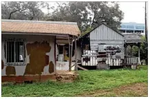  ?? SHOAL CREEK CONSERVANC­Y ?? Two Wood Street Settlement houses endured for more than 100 years before being demolished in 2014 for future developmen­t despite attempts to protect the houses and land.