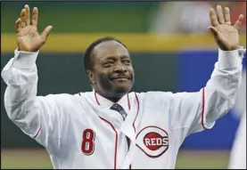  ?? AL BEHRMAN/AP ?? Cincinnati Reds Hall of Fame second baseman Joe Morgan acknowledg­es the crowd after throwing out a ceremonial first pitch prior to the Reds’ baseball game against the St. Louis Cardinals, in Cincinnati on April 7, 2010.