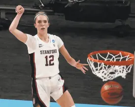  ?? Morry Gash / Associated Press ?? Stanford’s Lexie Hull makes a threepoint­er during the first half of an Elite Eight game against Louisville in San Antonio.