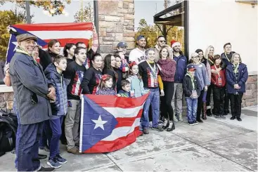  ?? Michael Minasi / Houston Chronicle ?? Members of Houston Methodist, Texans United for Puerto Rico and Interfaith of The Woodlands pose for photos with Houston Astros shortstop Carlos Correa and pitcher Michael Feliz during a toy drive on Saturday, Dec. 9, 2017, at Houston Methodist...