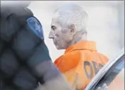  ?? Gerald Herbert Associated Press ?? ROBERT DURST is escorted to Orleans Parish Prison last month. He is accused of killing Susan Berman.