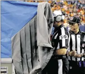  ?? AP ?? The NFL may do away with refs going to the sideline to view replays. Instead, a tablet would be brought on the field and the decision made in league headquarte­rs.