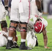  ?? Sean M. Haffey/getty Images ?? Alabama’s season comes to a halt as Jalen Milroe (4) ends up short of the end zone on a fourth-down play in overtime.