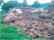  ??  ?? Compound wall collapsed due to heavy rains at Ramappa temple in Warangal. — DC