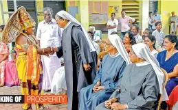  ?? — PTI ?? A man dressed up as Mahabali, a mythical king of Kerala, shakes hands with a nun during Onam celebratio­ns at a flood relief camp in Kochi on Saturday.