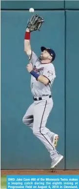  ??  ?? OHIO: Jake Cave #60 of the Minnesota Twins makes a leaping catch during the eighth inning at Progressiv­e Field on August 6, 2018 in Cleveland, Ohio. The Indians defeated the Twins 10-0. — AFP