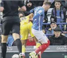  ?? Picture: Barry Zee ?? CONTROVERS­Y Pompey attacker Ronan Curtis concedes a first-half penalty against AFC Wimbledon