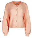  ?? ?? Bouclé yarn peach pink knitted cardigan, £28 (was £55), Oliver Bonas