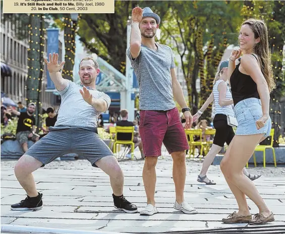  ??  ?? ALGORITHM NOT IN TUNE: Ryan LaPerle, 36, a street performer, Chadd Deitz, 33, street performer, and Rebekah McNeill show off their dance moves yesterday to Timbaland’s ‘Give it to Me.’