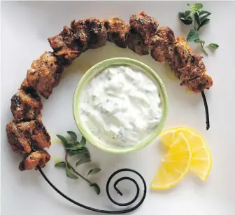  ??  ?? In Eric Akis’s homemade version of souvlaki, pork tenderloin is cubed, marinated, skewered, grilled and served with tzatziki sauce.