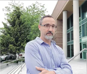  ?? KIM BOLAN ?? Vaughn Smeltzer, who tried to save Red Scorpion gang leader Jonathan Bacon’s life, stands outside the Kelowna Law Courts on Thursday. Bacon was killed when his vehicle was sprayed with gunfire.