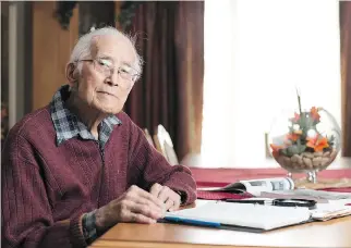  ?? MICHAEL BELL ?? Reginald Bing-Wo, 96, sits with his notes on the Gardiner Dam at his home at College Park Retirement Residence in Regina. He battled prevailing anti-Chinese sentiment in his early decades to become one of the engineers who worked on the dam near Elbow,...