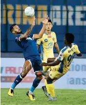  ?? PIC/PTI ?? Players of Chennaiyin FC and Kerala Blasters FC ( Yellow Jersey) vie for the ball during ISL football match at Jawaharlal Nehru Stadium in Chennai, on Friday