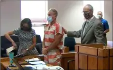  ?? KUSA via AP ?? In this still image from video, Barry Morphew (center) appears in court in Salida, Colo., on Thursday.