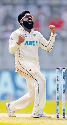  ?? — AP ?? New Zealand spinner Ajaz Patel celebrates the dismissal of India’s Mohammed Siraj on Day Two of the second Test in Mumbai on Saturday.