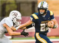  ?? APRIL GAMIZ/THE MORNING CALL ?? Executive Education Academy’s Anthony Roman carries the ball against Catasauqua’s Javier Sobrado during the District 11 Class 2A football final Saturday in Whitehall.