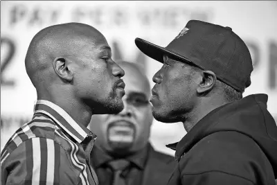  ?? JOHN LOCHER / AP ?? Floyd Mayweather (left) and Andre Berto will square off at the MGM Grand Garden Arena in Las Vegas on Saturday for Mayweather's WBC and WBA welterweig­ht titles. The unbeaten Mayweather (48-0) has vowed this will be his last fight.
