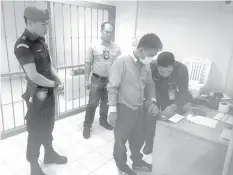  ?? ASSOCIATED PRESS ?? Police process suspected wildlife trafficker Boonchai Bach, a 40-year-old Thai of Vietnamese descent in Bangkok, Thailand. During a press conference Saturday, police announced the arrest of Boonchai who allegedly fueled much of Asia's illegal wildlife...