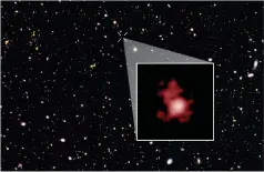  ?? NASA, ESA, AND P. OESCH (YALE UNIVERSITY) ?? QUICK EATER. The galaxy GN-z11 (inset), seen here in a Hubble Space Telescope image, seems to have a black hole gobbling up material faster than the Eddington limit predicts.